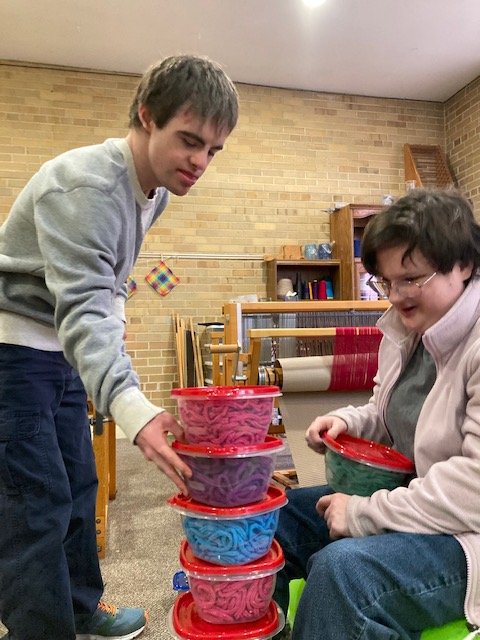 Clients build a tower of containers together