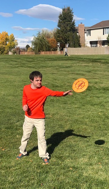 A client throws a frisbee